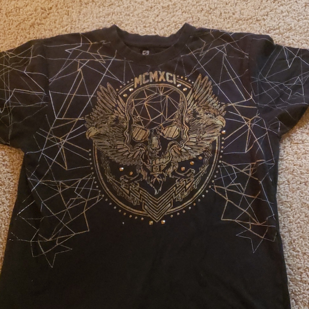 A Rocker Skull shirt with dull spikes one